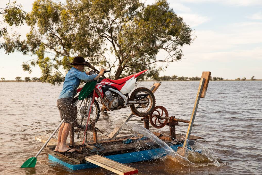 George Smith (also on our cover) from Scarsdale Station, east of Broken Hill, built a paddle wheel boat using bits and pieces from the farm when their lake filled with rain. Photo: Jane Smith