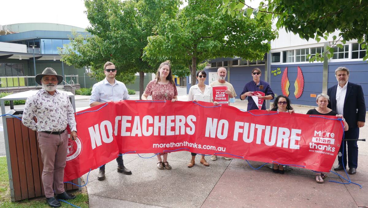 President of the NSW Teachers Federation Angelo Gavrielatos (far right), with NSW Teachers Federation Country Organiser for the Queanbeyan office Waine Donovan (far left) and some of their members of the Bega electorate. Photo: Ellouise Bailey
