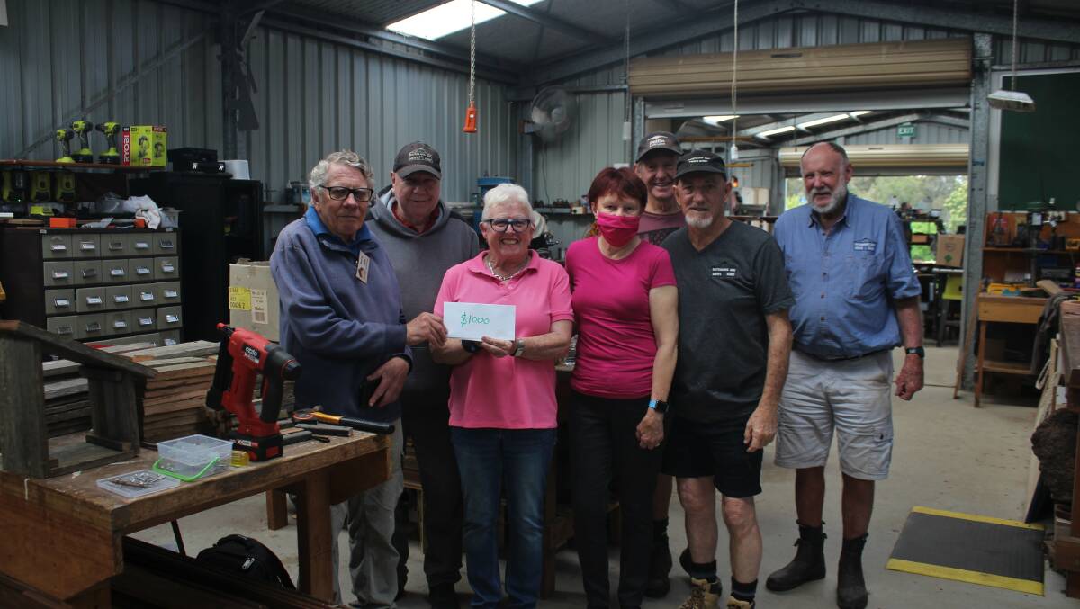 Jude Raffety, breast cancer patient Alison O'Hara, vice president Les O'Connell and the Batemans Bay Men's Shed committee supporting the McGrath Foundation. Picture James Tugwell