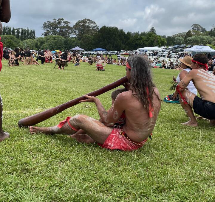 The didgeridoo player at the Yuin birriga bunaan at Gulaga Oval had a toddler sitting with him, absorbing the culture and atmosphere. Picture by Marion Williams