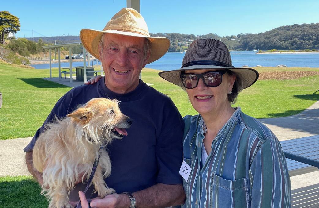 Mia, with. owners Terry and Diane, was the smallest dog in the Tailwaggers walk in Narooma on September 17. Picture by Marion Williams