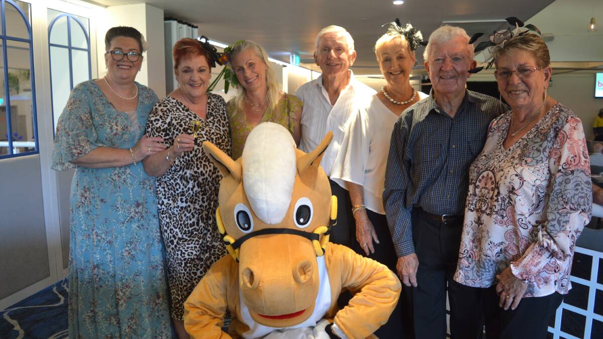 Nerida Wing, Mary Goodridge, Johanne Hollman, Ron and Gaye Biggs and Pat and Errol Bill with the Melbourne Cup mascot at Catalina Club on Melbourne Cup Day.