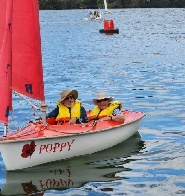 Sailing with support: Sailability newcomer 97-year-old Lee Gleeson (right) sailed Moruya River in late 2022 with volunteer Alistair Dally. Picture via Sailability Batemans Bay/Paula Gleasson