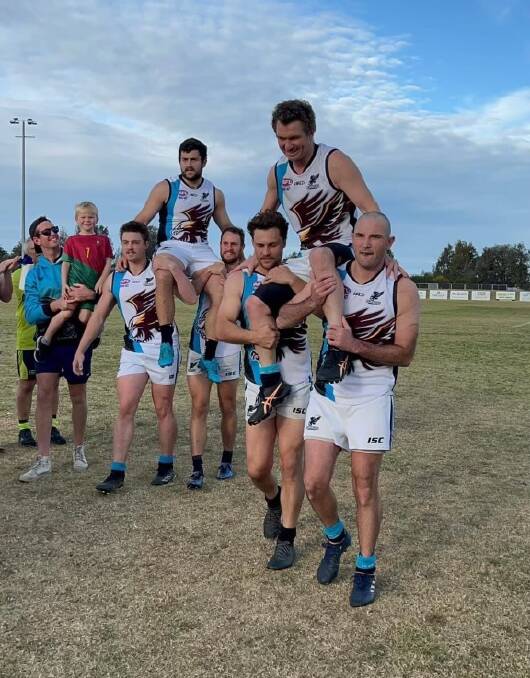 Josh Mulrooney (left) and Sam Millynn were chaired off after the Seahawks' triumphant win against the Molonglo Juggernauts on August 12.