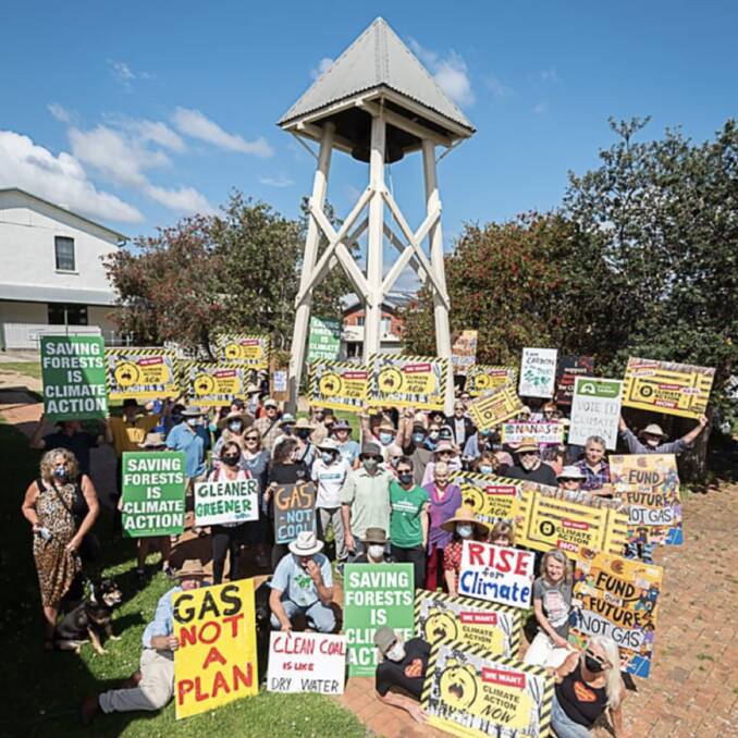 350 Eurobodalla will ring the bell at St John's Anglican Church in Moruya 28 times to mark the beginning of COP 28 on December 2. Pictured are 350 Eurobodalla members ringing the bell in 2021. Picture by Gillianne Tedder