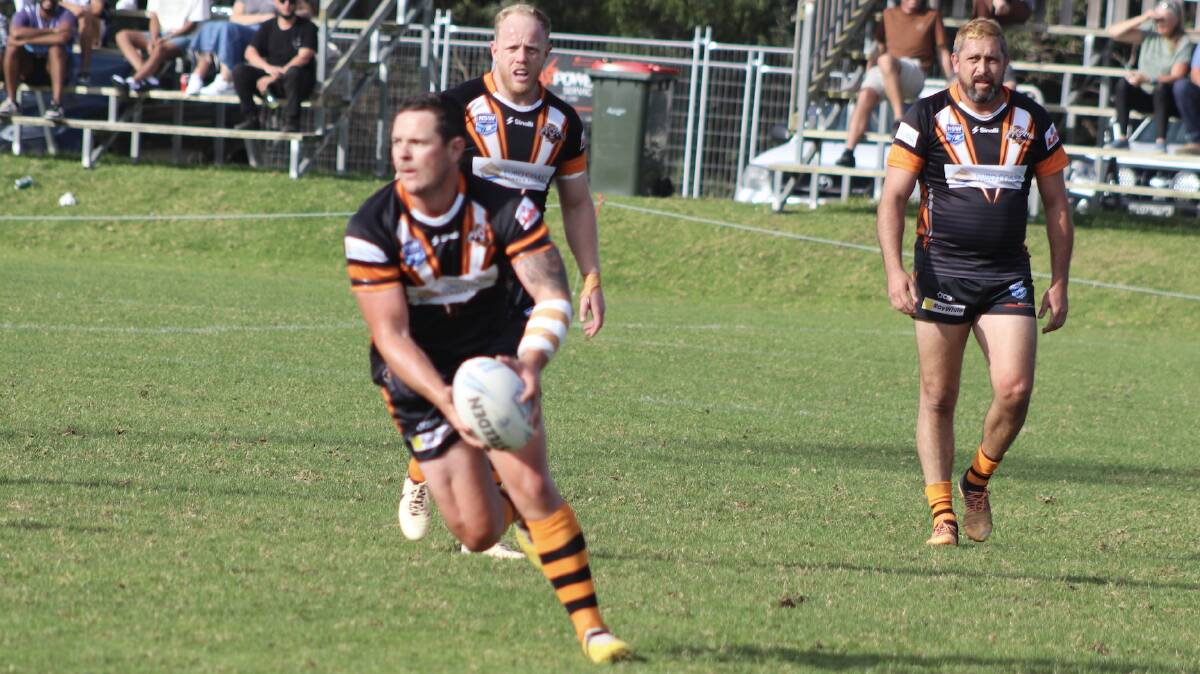 Jake Hawkins with ball, playing for Batemans Bay Tigers. Picture by Mick Rowley