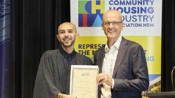 Baeden Davis is presented with his graduation certificate at a presentation in Sydney. Picture supplied