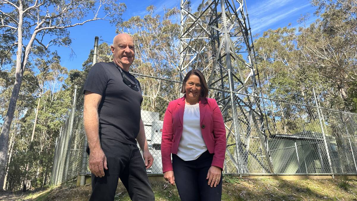 Fiona Phillips MP and President of the South Durras Community Association, Trevor Daly at the South Durras NBN fixed-wireless tower where the cables were relocated. Picture supplied.