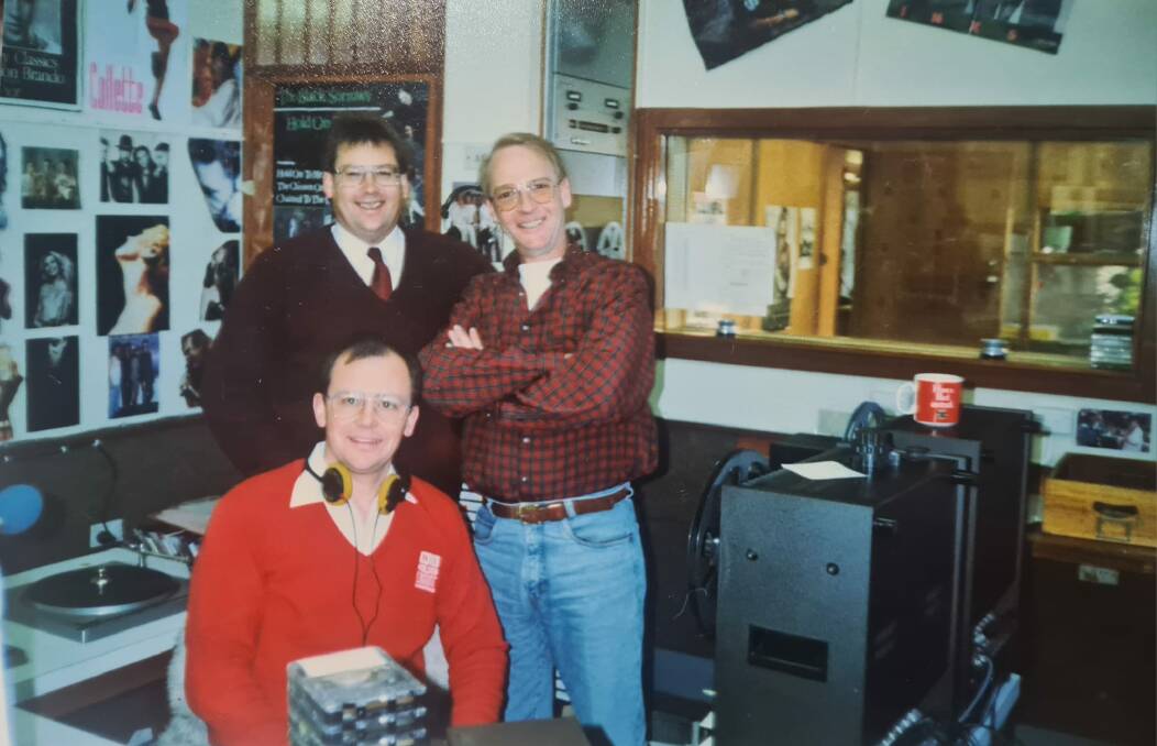 Graeme Northey (seated), former 2GN general manager, Steve Swadling and John Blackman at the station's McKell Place studio in the 1990s. Picture supplied. 