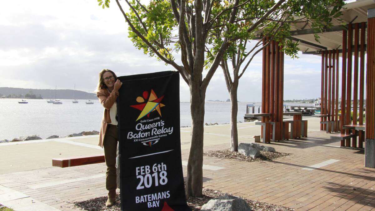 Shire mayor Liz Innes unfurls the first Batemans Bay Queen’s Baton Relay banner. Batemans Bay is one of 13 NSW communities to host the relay in the lead to the Commonwealth Games. The baton travels through The Bay on Tuesday February 6.