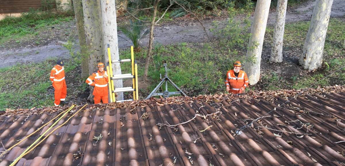 Moruya SES assist with a damaged roof at Mystery Bay. Photo courtesy of Seb Bachler.