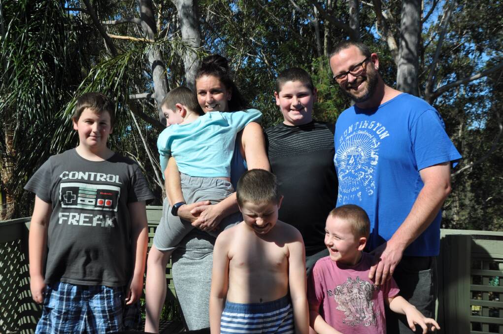 NDIS STRESS: Catalina parents Bec Curby and Matt Blake are calling for changes to the NDIS rollout to eliminate stress for families. Pictured with children Hunter, Xavier, Seth, Tallan and Dash. 