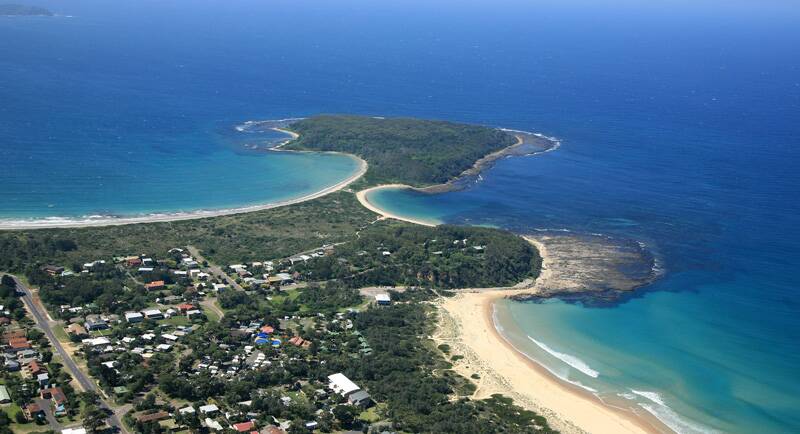 An aerial photo of Broulee Island, where a man was found deceased on a boat on Friday morning.