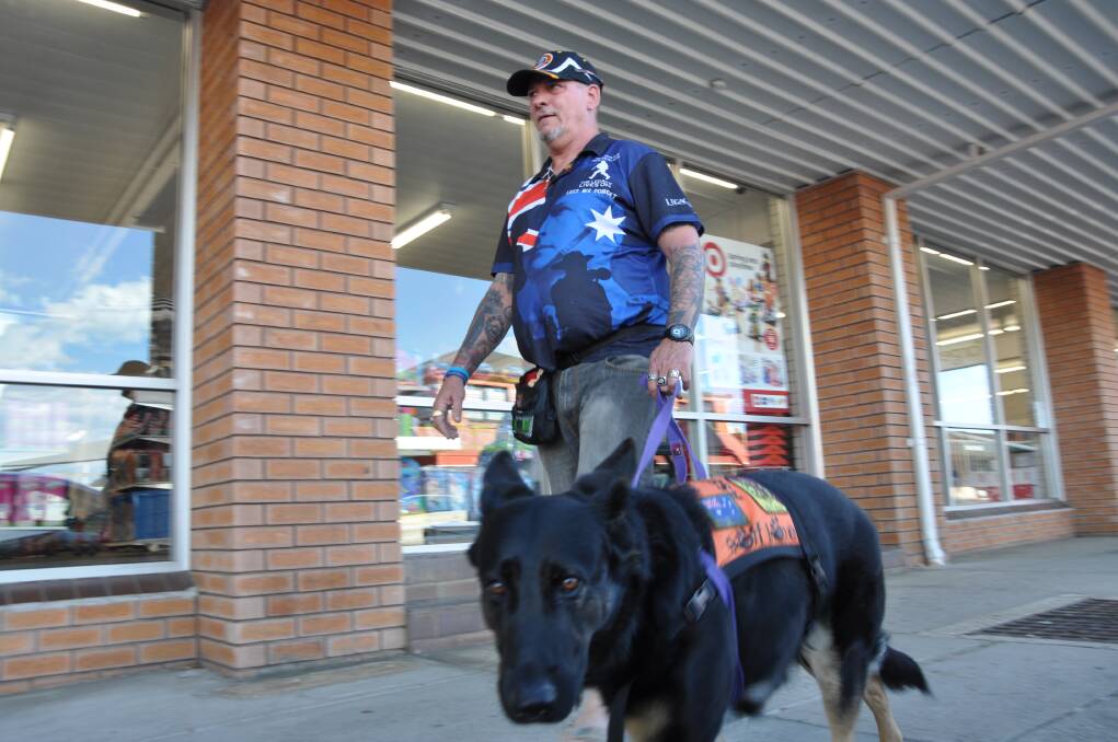 HELPING PAW: Australian Army veteran Glenn Marskell with his assistance dog, Dakota. 
