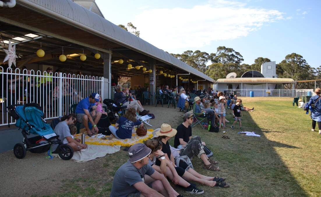GROOVY BABY: Revellers at this year's pared-back Granite Town festival, on the Moruya racecourse.