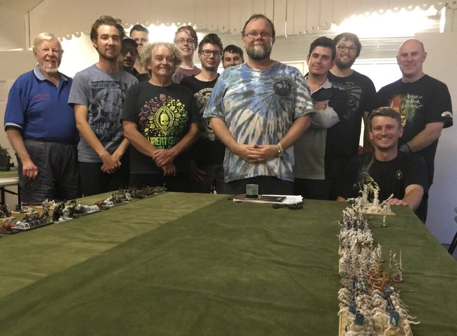 CHRISTMAS CAME EARLY: The Moruya Marauders gaming club received a heartfelt gift of Warhammer figurines from the Brice family. 
